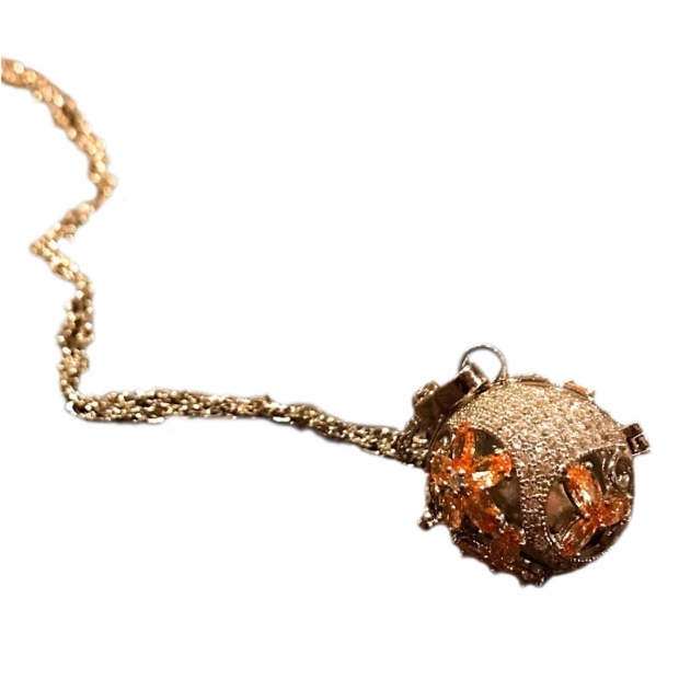 Music sphere steel pendant with chain pave set colourless and orange cubic zirconium flower decorated